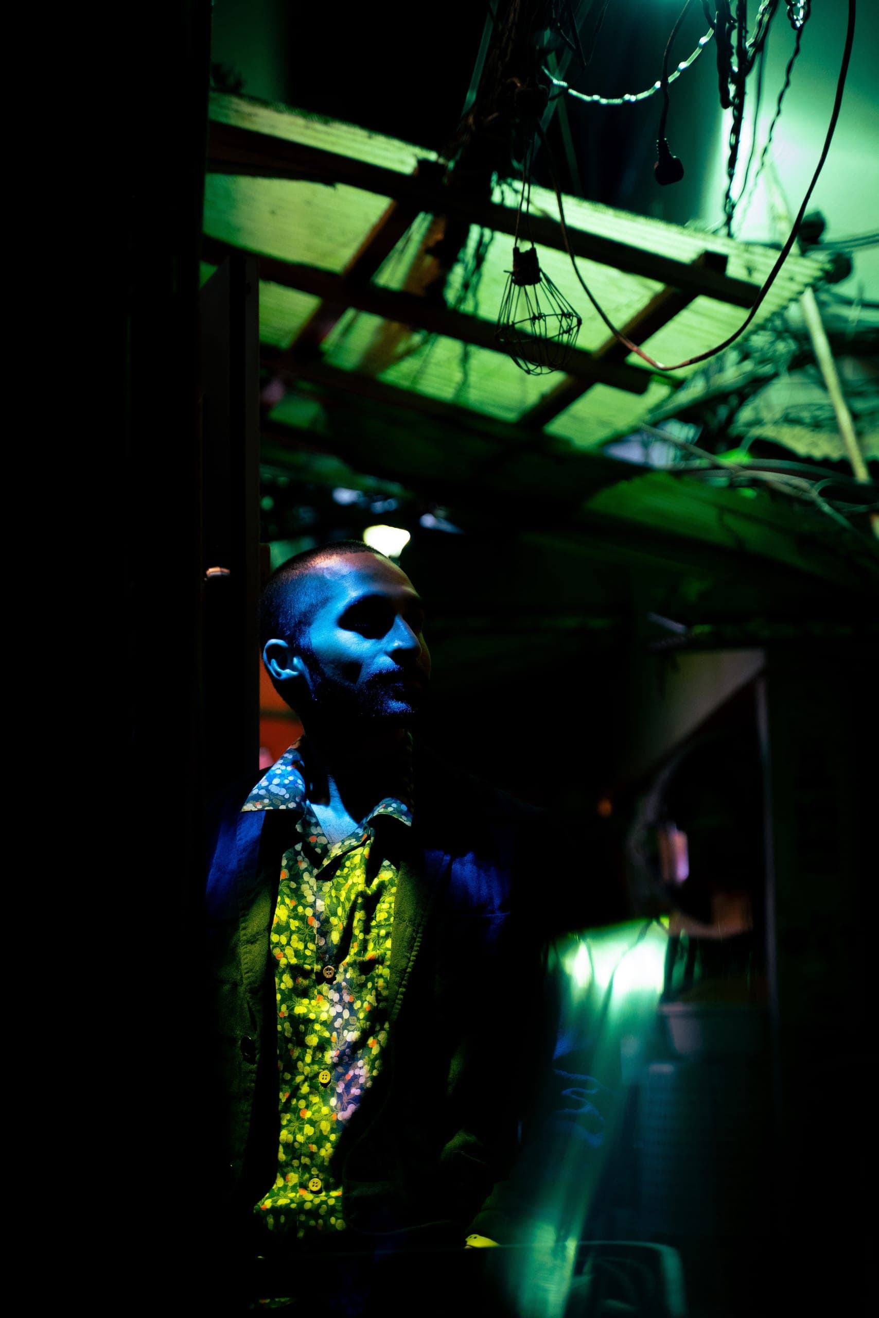 Sean Rose in a dark, moody scene